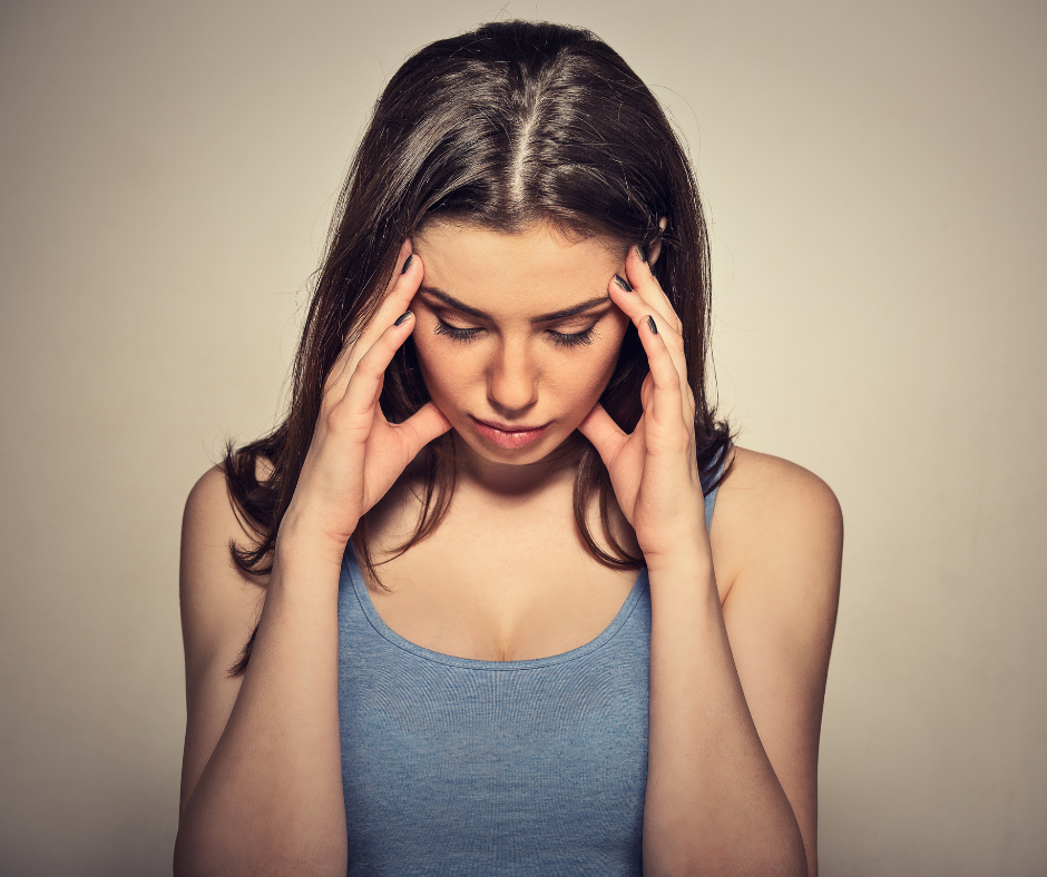 Stressed woman considering the link between stress and tinnitus